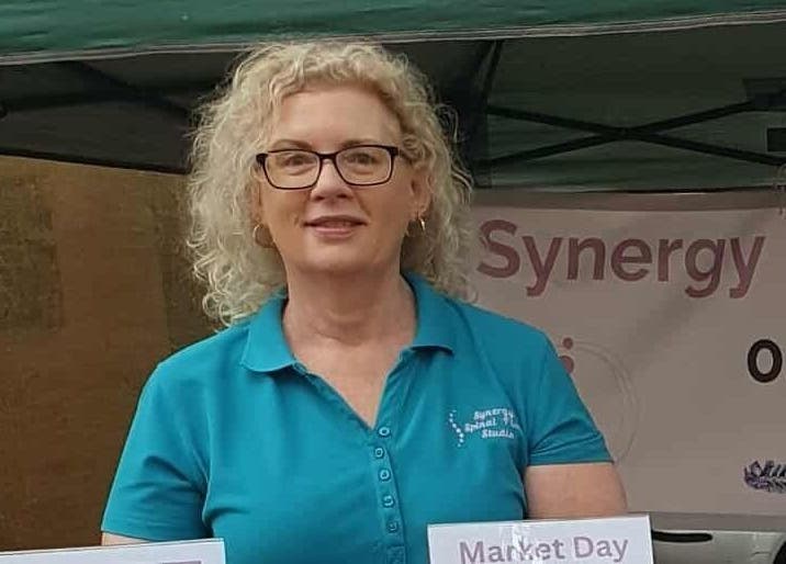 Representative of Synergy Spinal Flow Studio at market event in Mareeba, Queensland, AU.