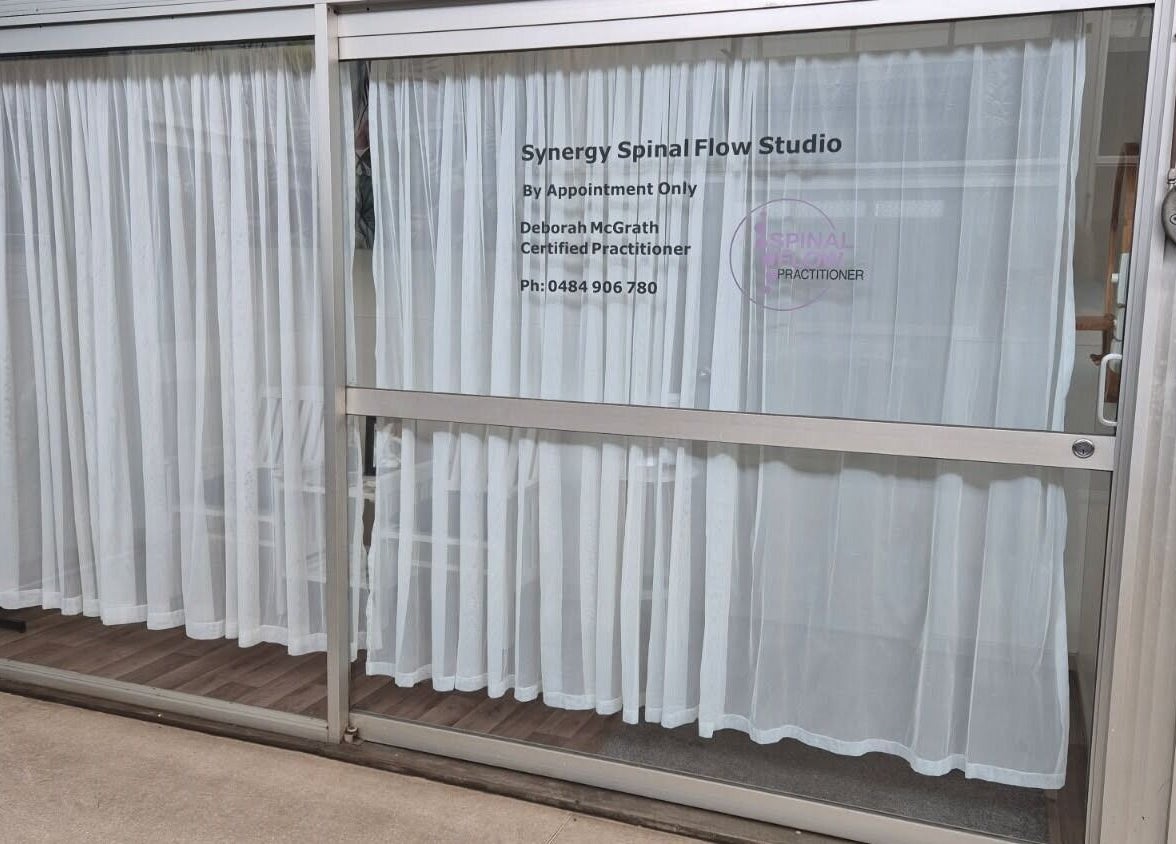 Exterior view of Synergy Spinal Flow Studio in Mareeba, Queensland, AU with white curtains.