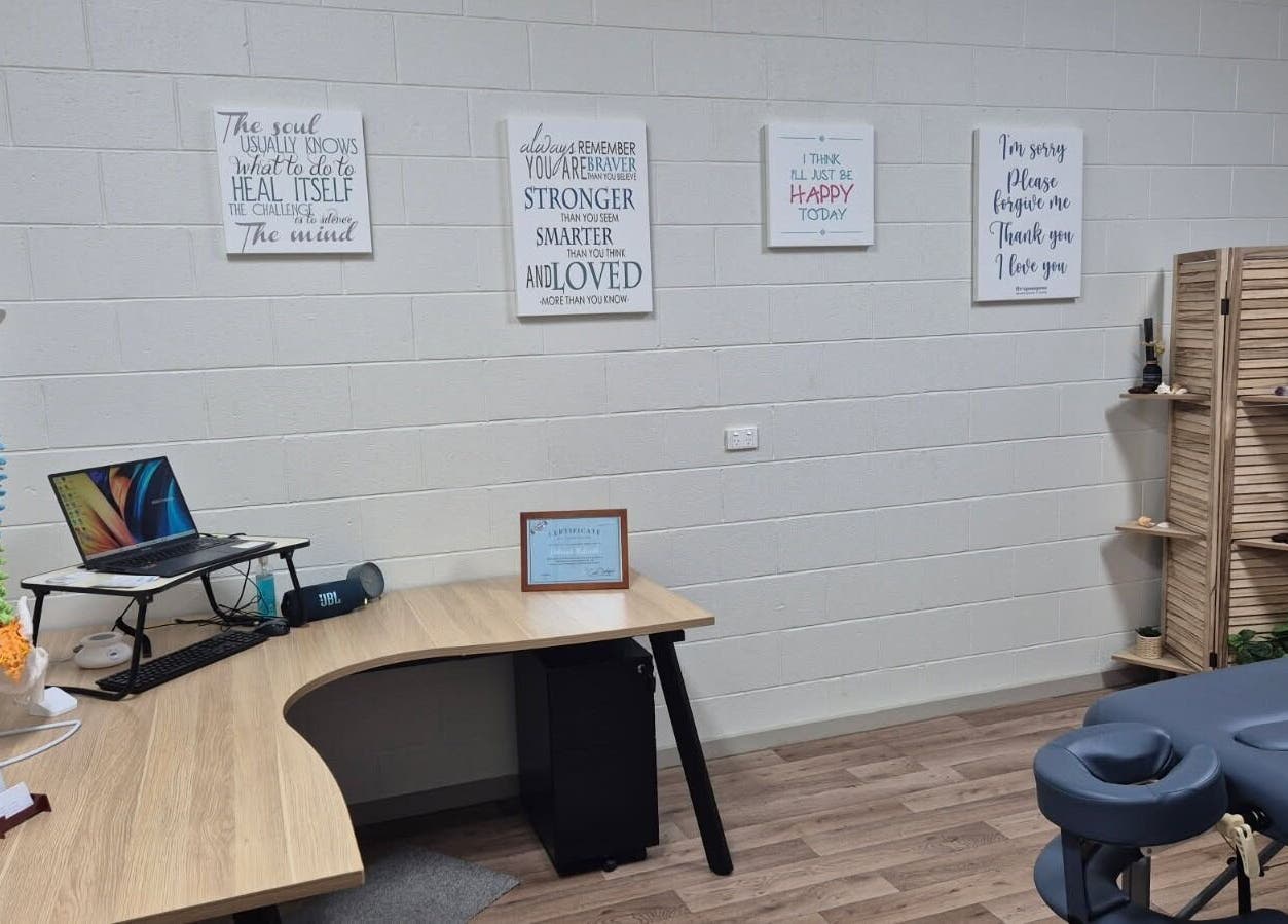 Calming therapy room at Synergy Spinal Flow Studio, Mareeba, Queensland, AU with massage table and decor.