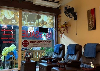 Interior view of Kunlarat Massage in Chiang Mai, TH, showcasing comfortable massage chairs and serene decor.