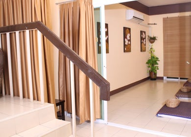 Elegant interior of Kunlarat Massage in Chiang Mai, showcasing serene decor and massage area.