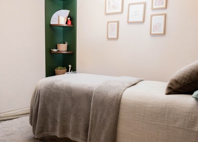 Soothing treatment room at Big Calm Reflexology, London, England, GB, featuring cozy decor and serene ambiance.