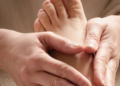 Foot reflexology session at Big Calm Reflexology in London, England, GB offering soothing relaxation.