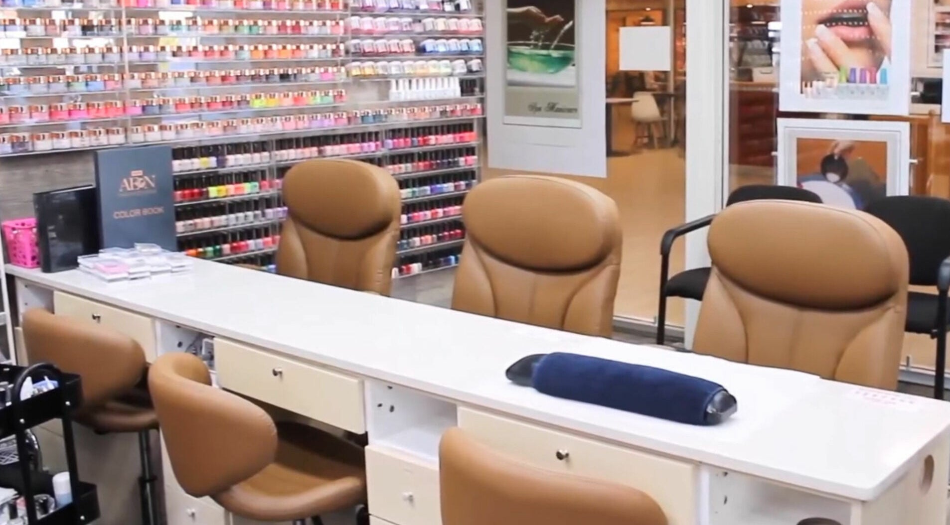 Nail salon interior at May Beauty Morley, Morley, Western Australia, AU showcasing elegant seating and polish display.
