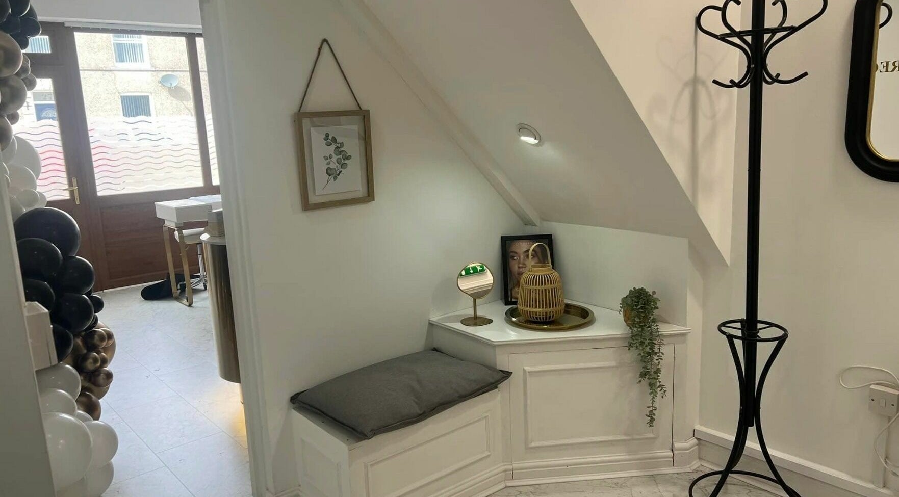 Cozy corner nook at Touch of Beauty in Cross Hands, Wales, GB, featuring elegant decor and comfortable seating.