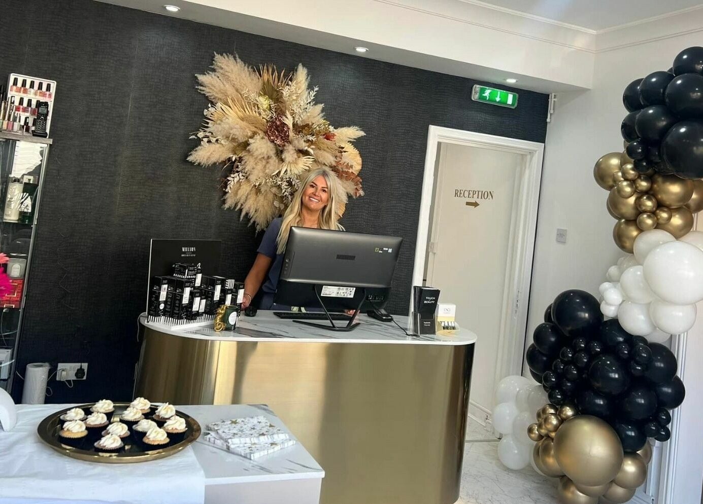Reception at Touch of Beauty in Cross Hands, Wales, GB featuring decor and a welcoming staff member.