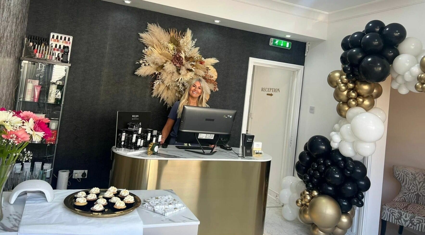 Reception at Touch of Beauty in Cross Hands, Wales, GB featuring decor and a welcoming staff member.