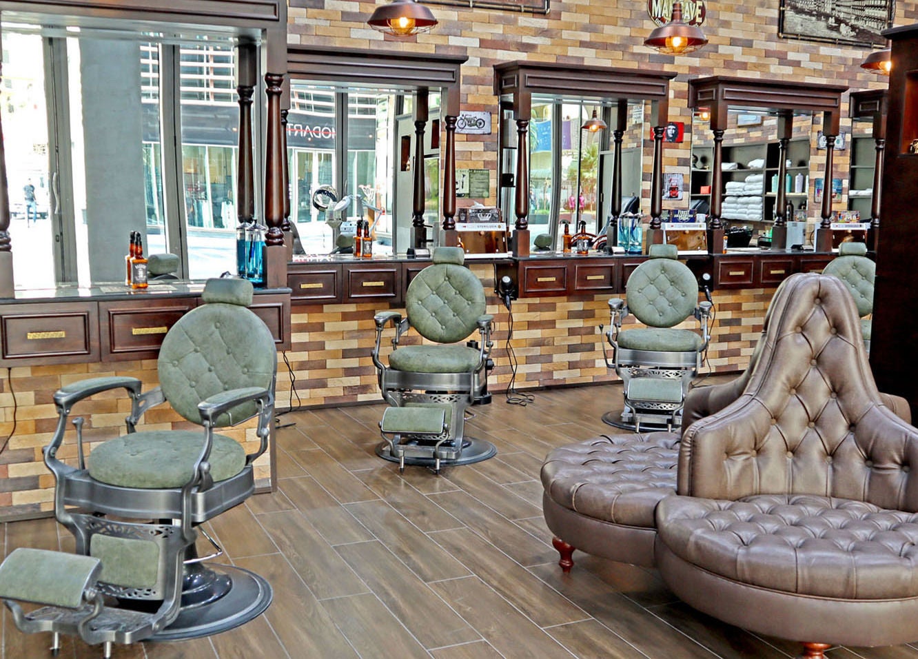 Elegant interior of Fade & Shave Barbers The Beach, JBR in Dubai, AE, featuring vintage barber chairs.