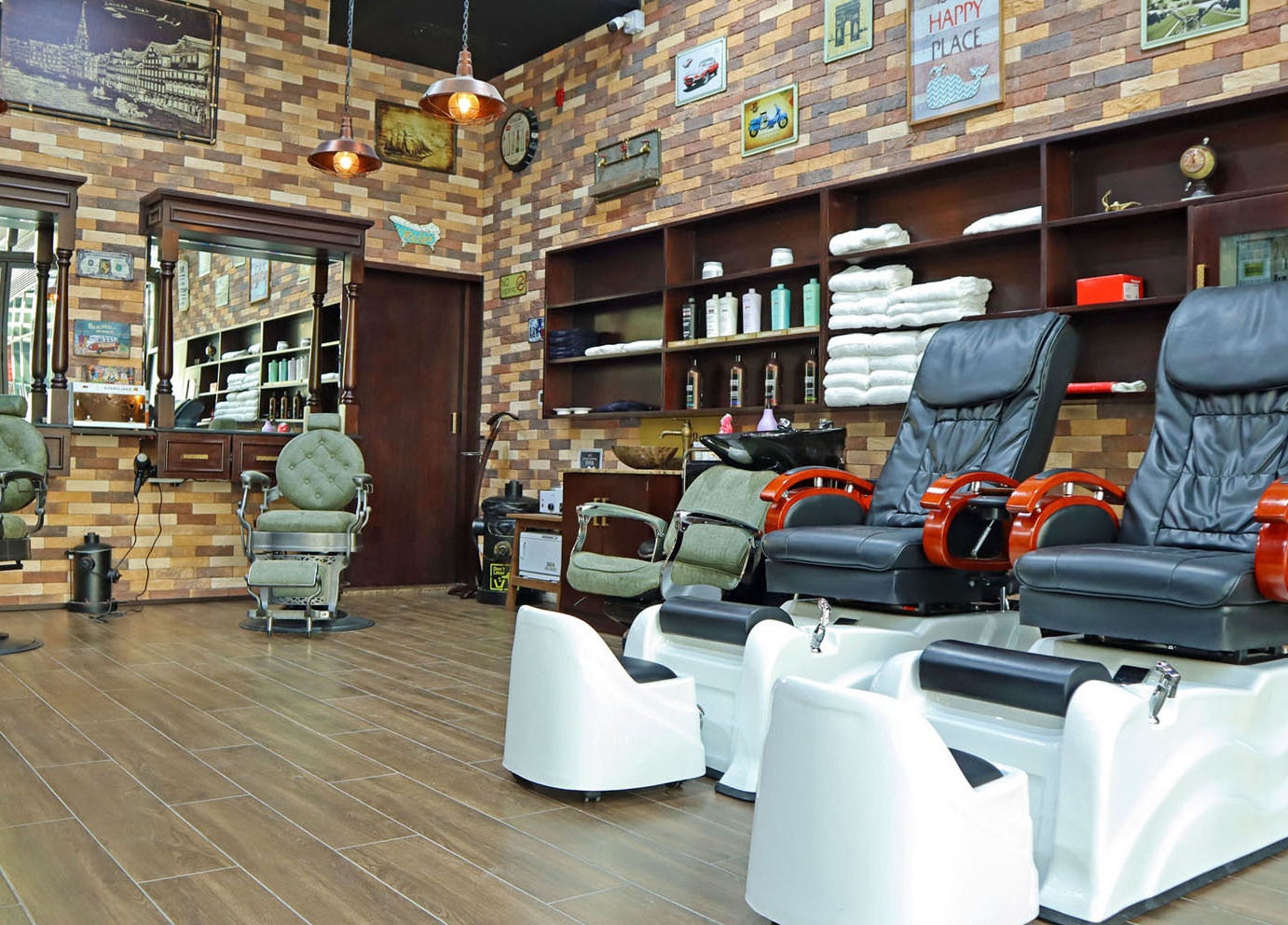 Interior view of Fade & Shave Barbers The Beach, JBR, Dubai, AE showcasing vintage barber chairs and decor.