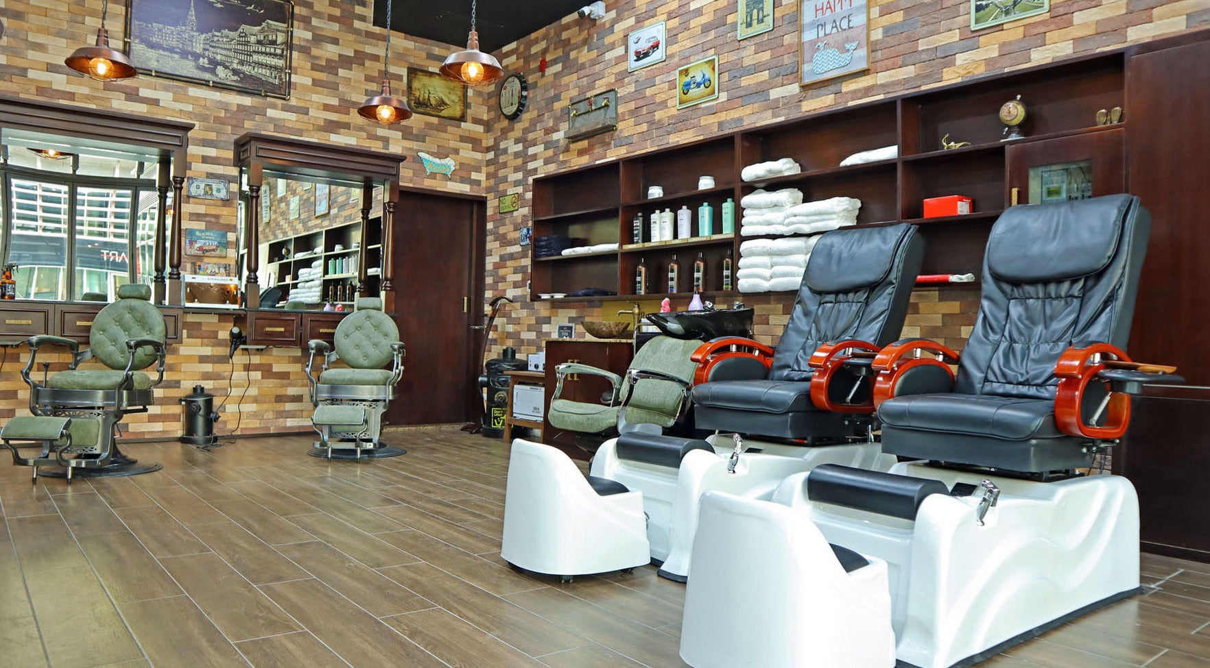 Interior view of Fade & Shave Barbers The Beach, JBR, Dubai, AE showcasing vintage barber chairs and decor.