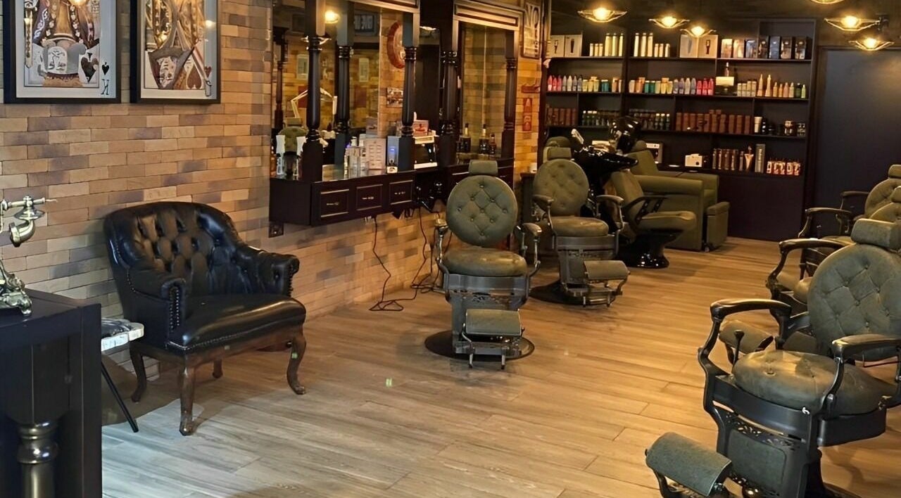 Interior of Fade & Shave Barbers LIV Residence, Dubai Marina, Dubai, AE, featuring vintage barber chairs.