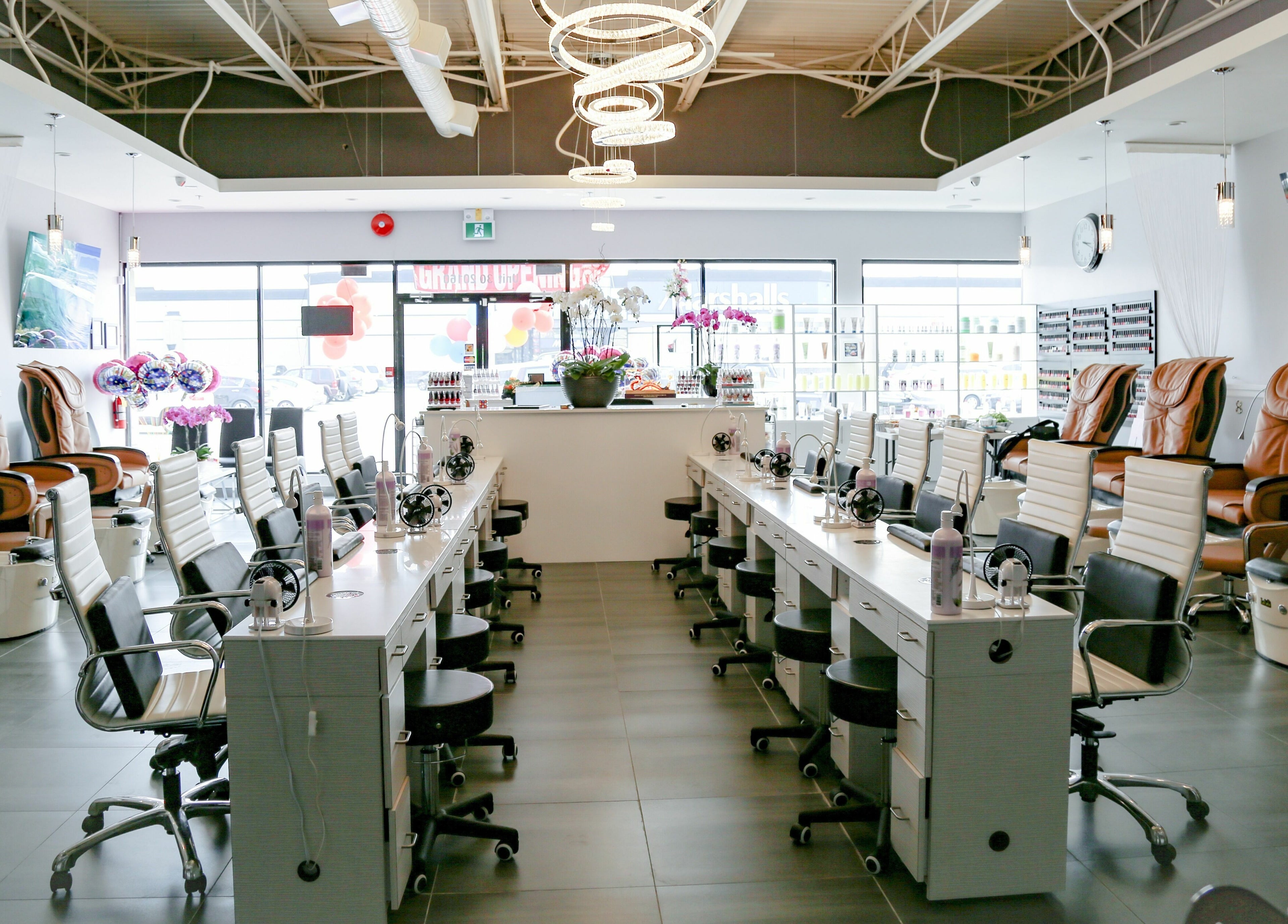 Spacious interior of LTN Nails & Spa, Langley City, British Columbia, CA with modern manicure stations and pedicure chairs.