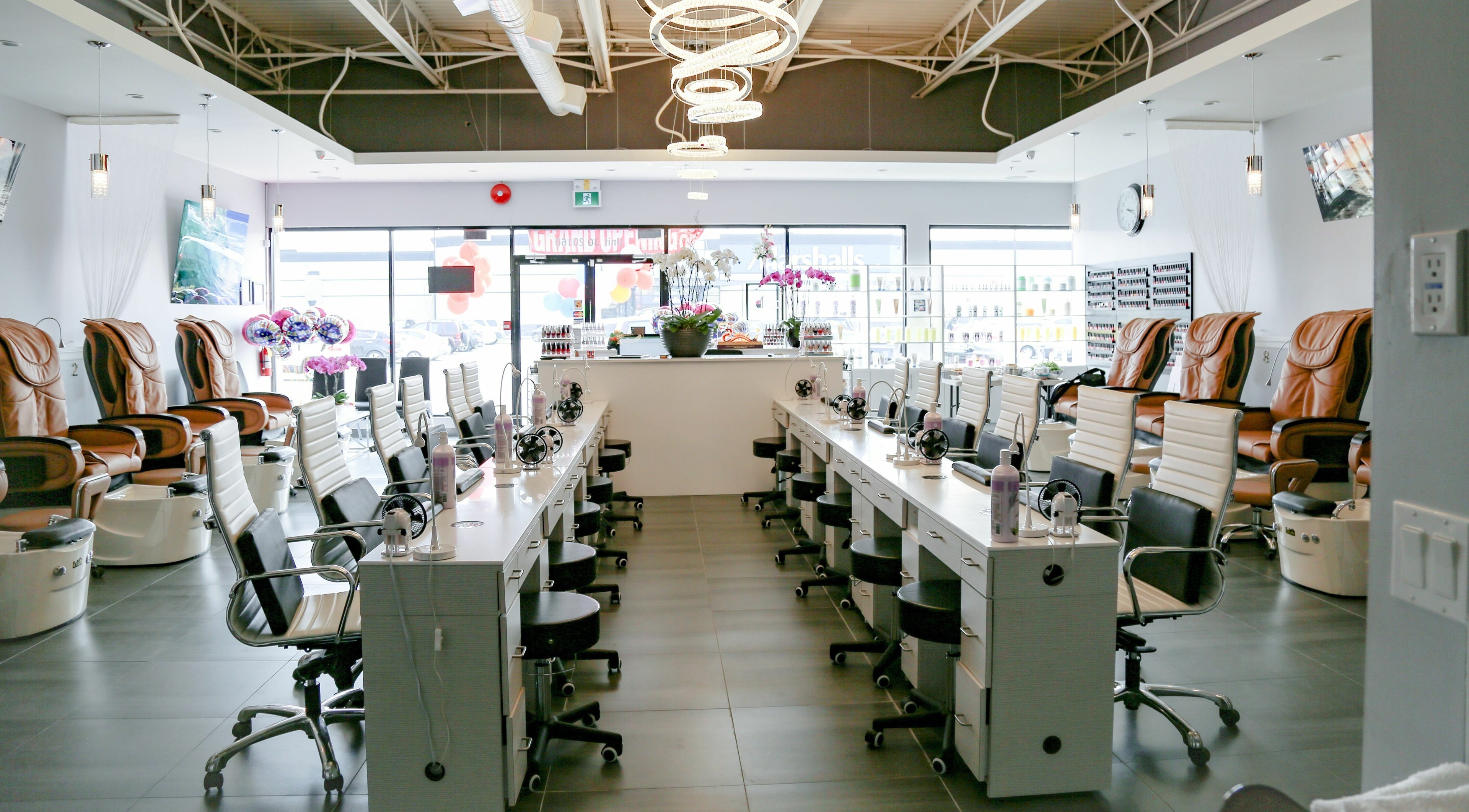 Spacious interior of LTN Nails & Spa, Langley City, British Columbia, CA with modern manicure stations and pedicure chairs.