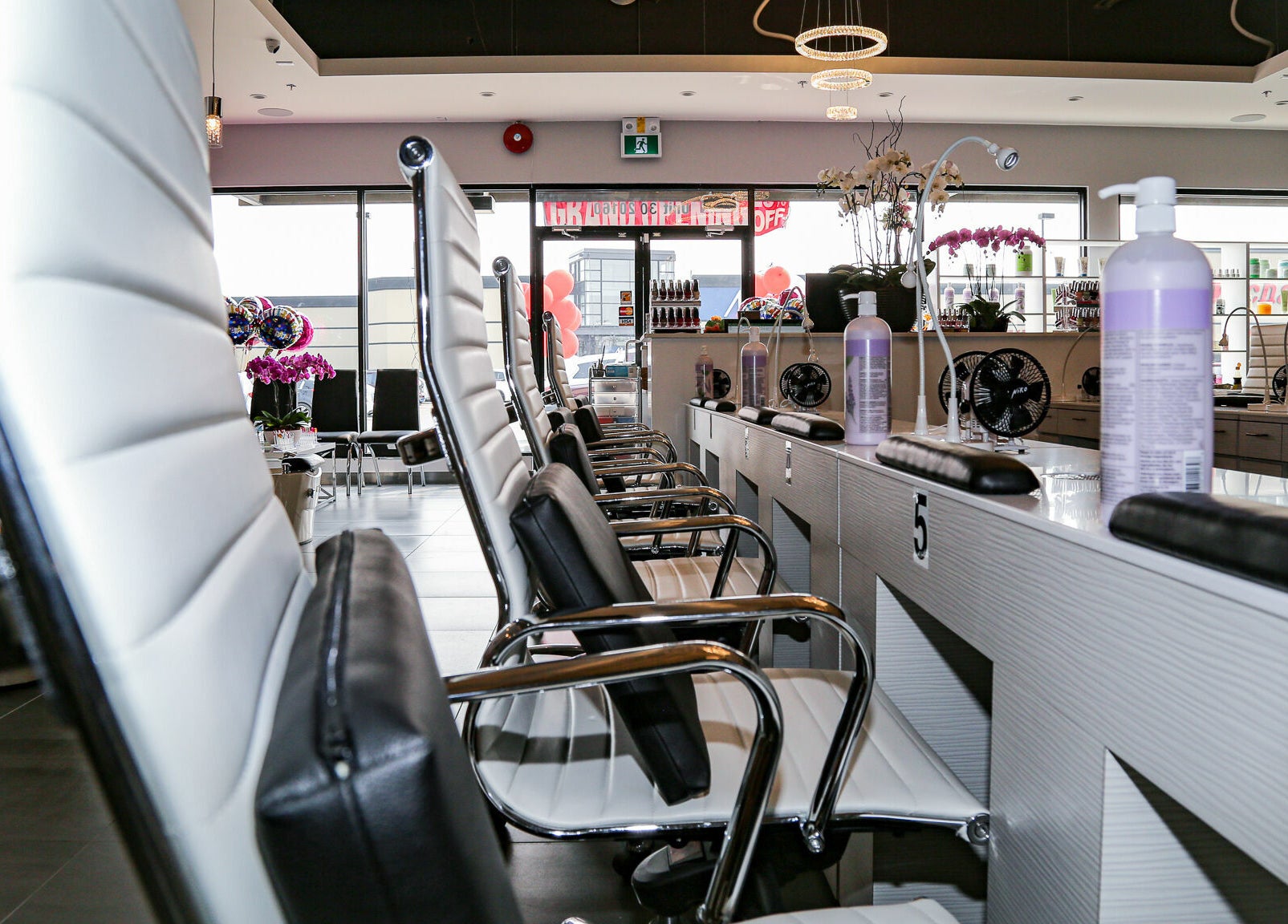 Elegant nail salon interior at LTN Nails & Spa, Langley City, British Columbia, CA, showcasing modern chairs.