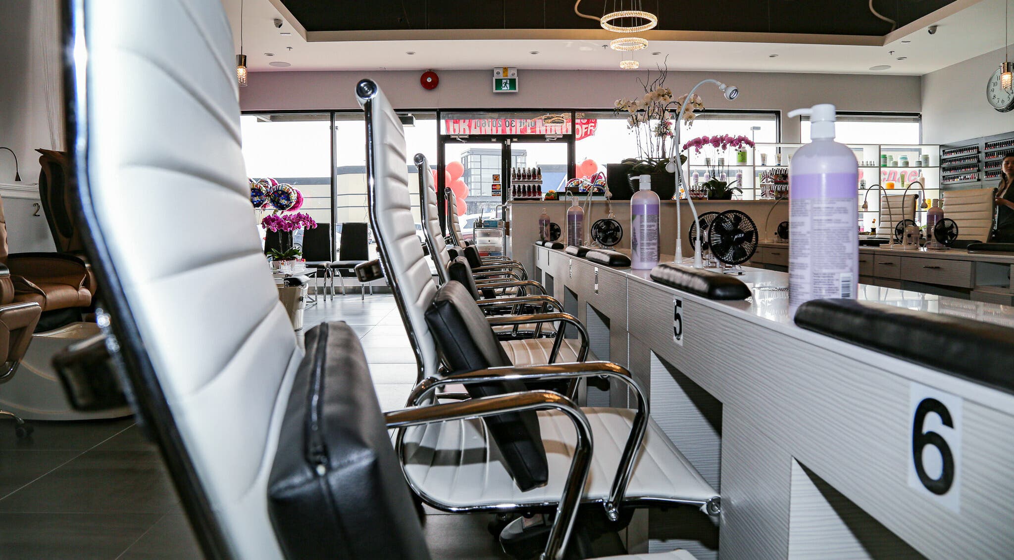 Elegant nail salon interior at LTN Nails & Spa, Langley City, British Columbia, CA, showcasing modern chairs.