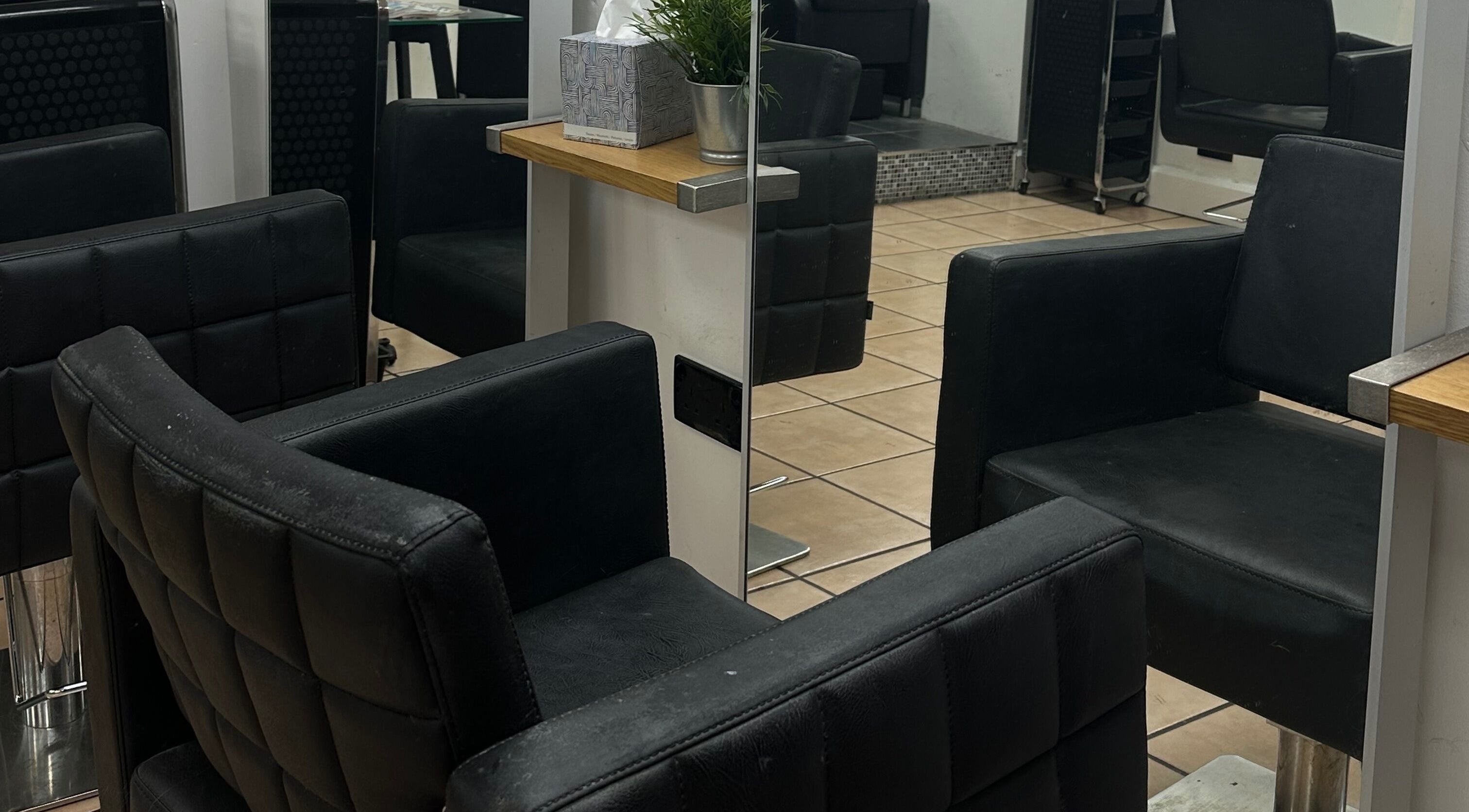 Elegant salon seating at Bella Vida Hair in Ormskirk, England, GB, showcasing modern luxury.