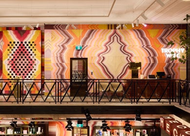 Bright, colorful interior of Trophy Wife Nails | Mecca Bourke St CBD in Melbourne, Victoria, AU with geometric wall art.