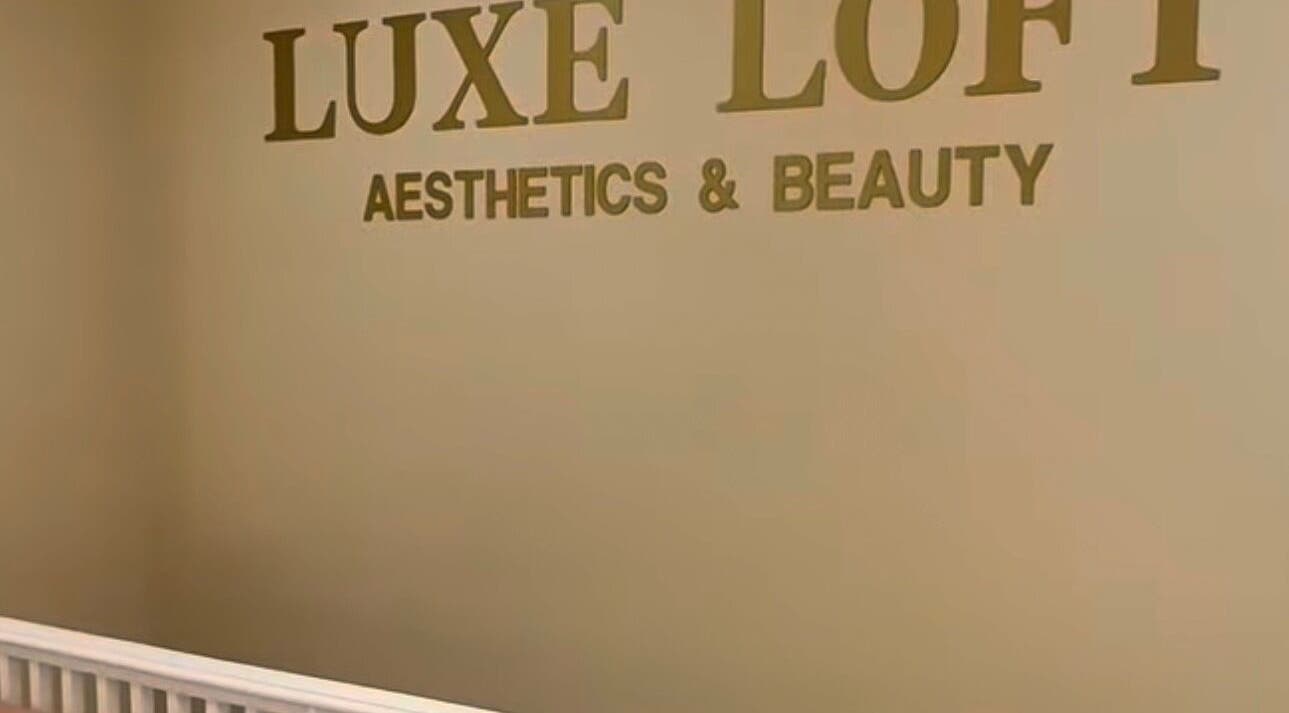 Revida Aesthetics X Luxe Loft wall sign in Deal, England, GB, showcasing elegant aesthetics branding.