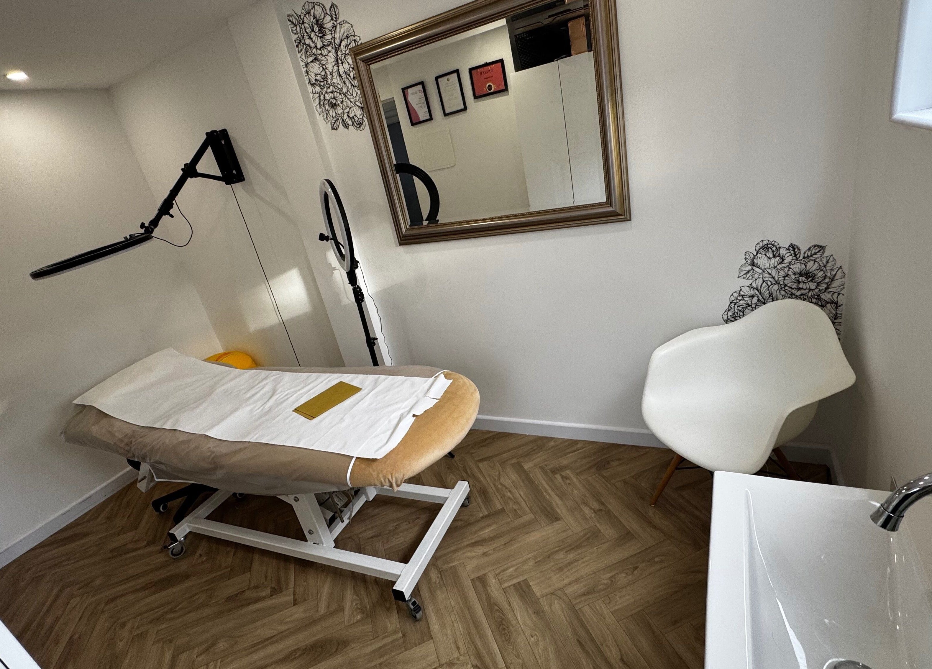 Tranquil treatment room at Revida Aesthetics, Broadstairs, England, GB, featuring a comfortable bed and modern decor.