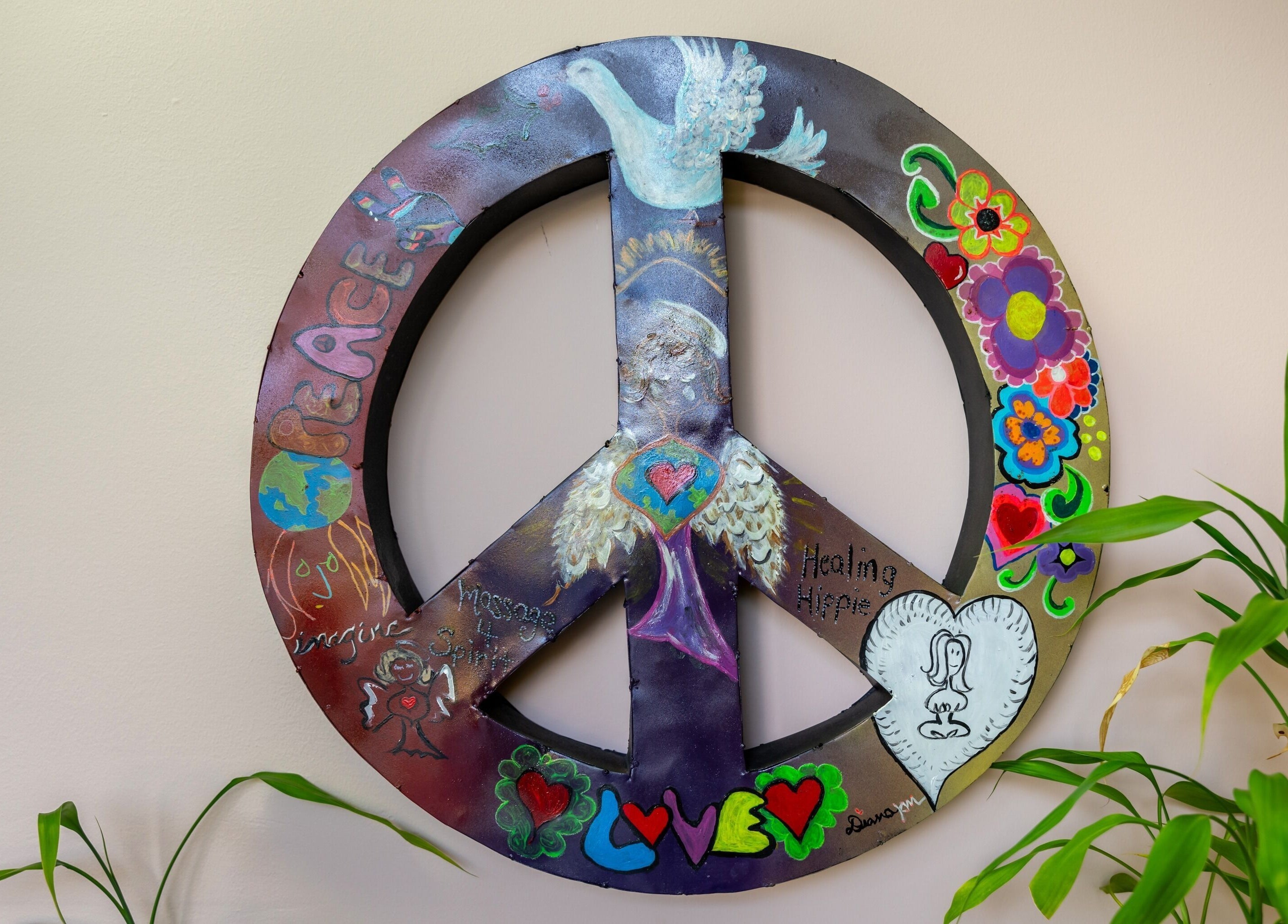 Colorful peace symbol art at Healing Hippie, Hampstead, North Carolina, US, depicting serenity and harmony.