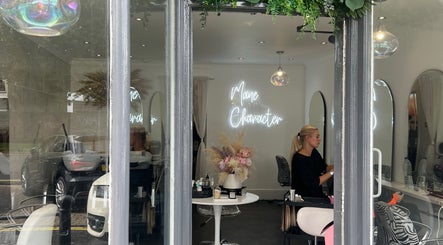 Interior of Mane Character Hair Salon in Portsmouth, England, GB, showcasing stylish decor and hairdressing setup.