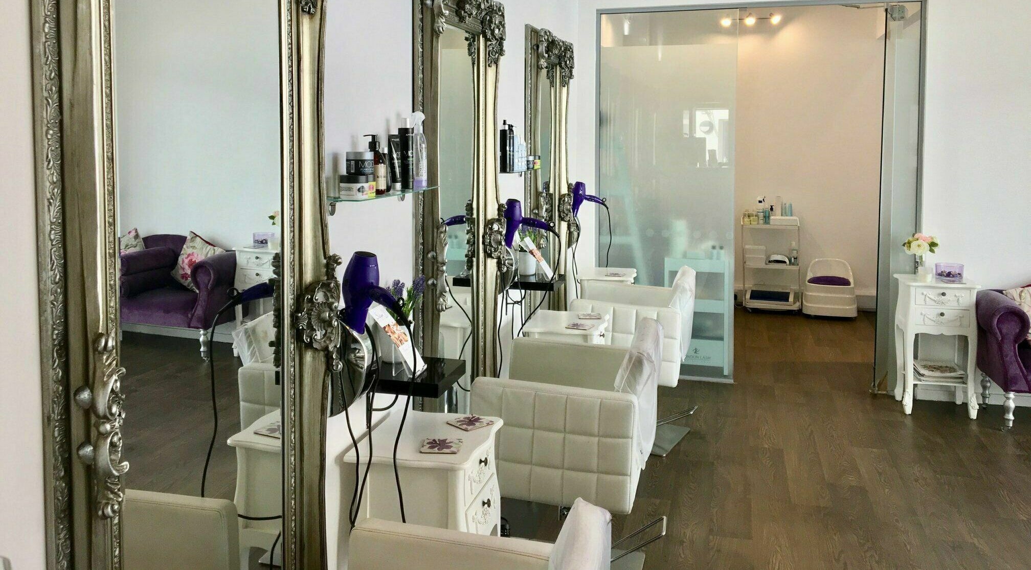 Luxurious salon interior with ornate mirrors at Hair, Brackley, England, GB.