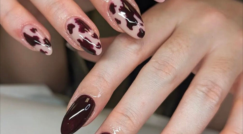 Elegant cow print nail design at Studio LAM, Peterborough, England, GB.