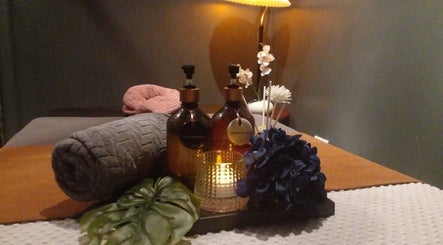 Relaxing spa setup at Gussanova Thai Massage Therapy, London, England, GB. Cozy ambiance with towels and spa oils.