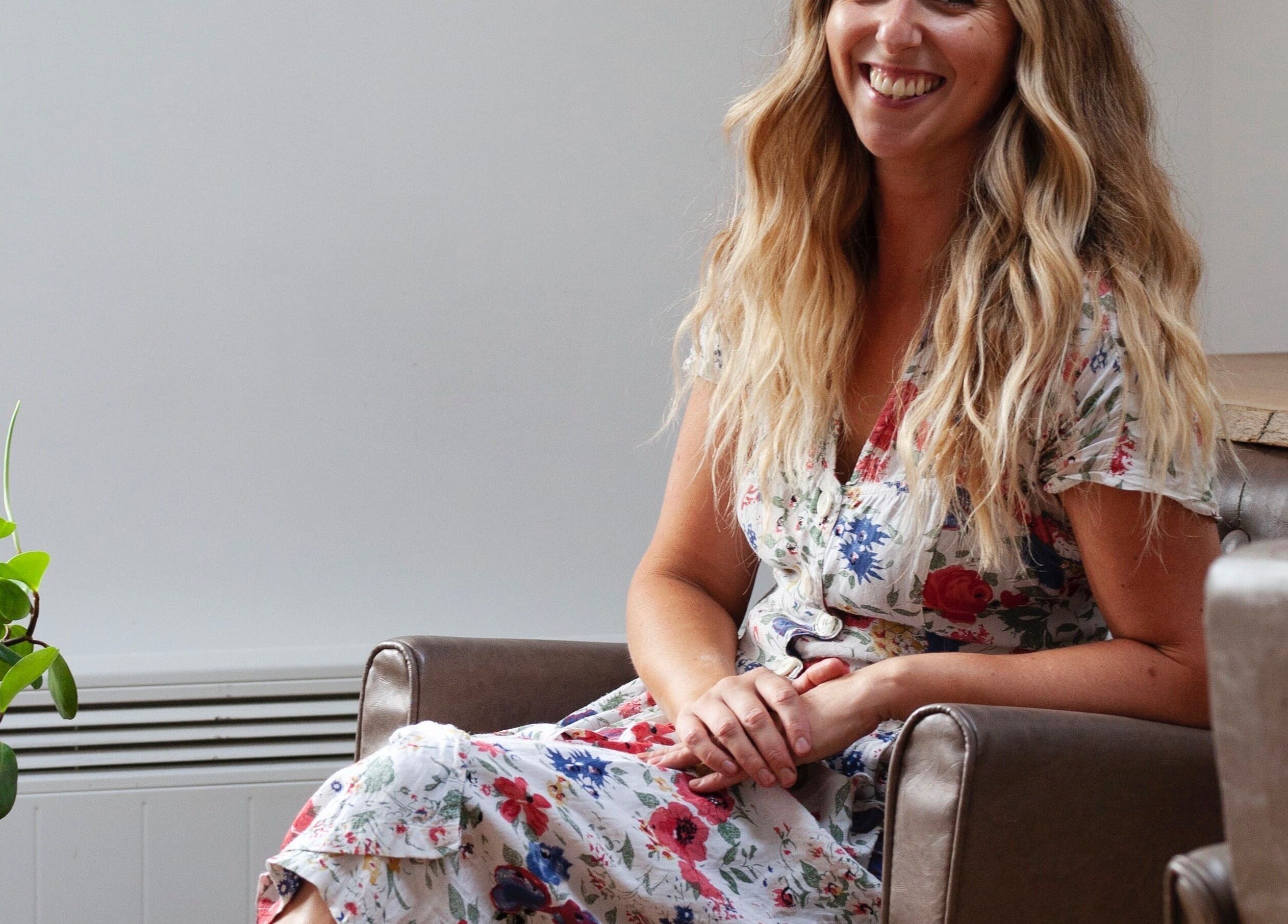 Woman with long hair smiling at Scarlett Collier Hair, Frome, England, GB.
