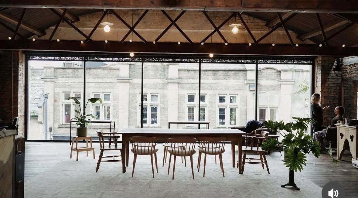 Chic loft interior at Scarlett Collier Hair, Frome, England, GB with stylish decor and large windows.