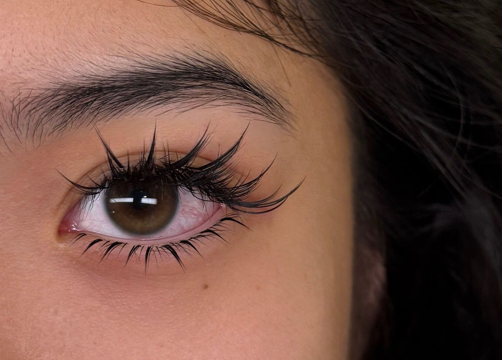 Close-up of eyelash extensions at Lash Fame Beauty in Calgary, Alberta, CA, showcasing elegant lash artistry.