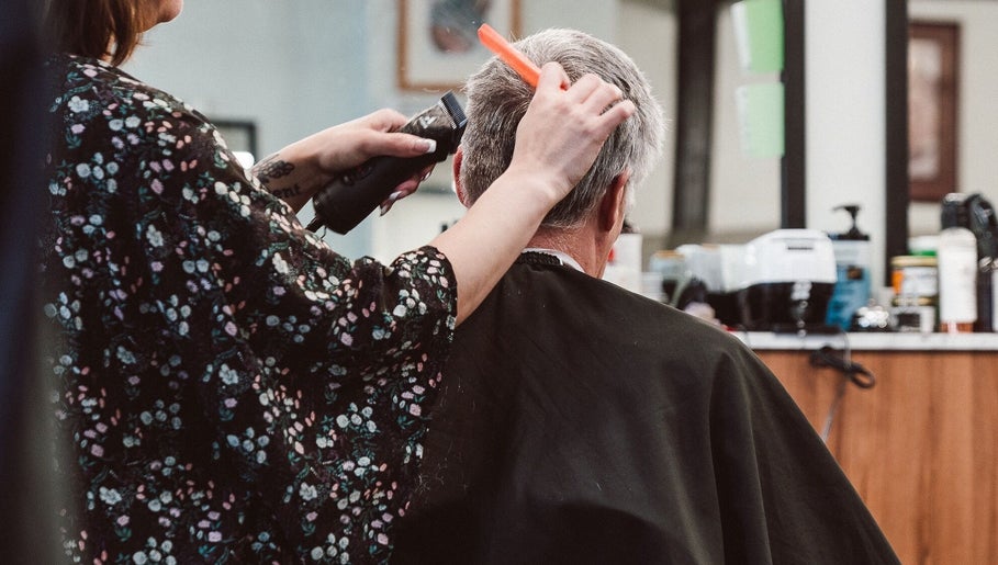 Professional haircut at Beck's Barbershop in Portland, Oregon, US, showcasing skilled barbering techniques.
