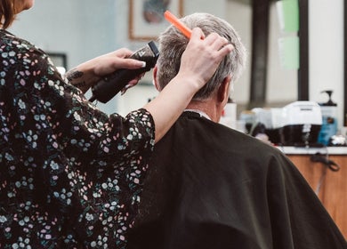Professional haircut at Beck's Barbershop in Portland, Oregon, US, showcasing skilled barbering techniques.