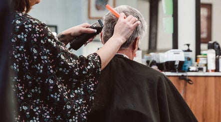 Professional haircut at Beck's Barbershop in Portland, Oregon, US, showcasing skilled barbering techniques.