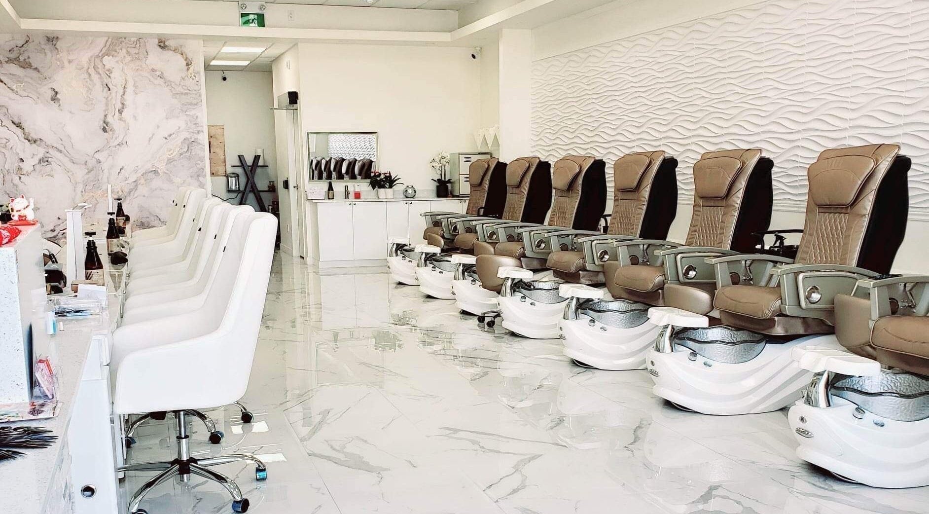Luxurious pedicure chairs and sleek manicure stations at Allure Nail Spa, Kitchener, Ontario, CA.