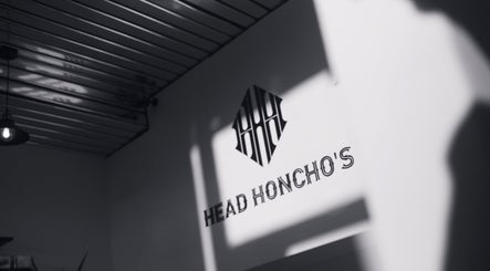 Elegant interior at Head Honcho's Barbershop/Salon, Newton Abbot, England, GB, showcasing modern design.