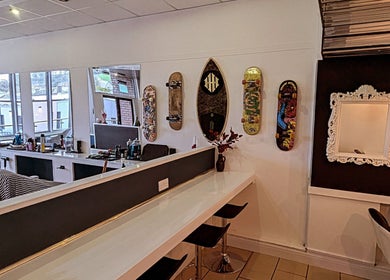 Trendy interior of Head Honcho's Barbershop/Salon in Newton Abbot, England featuring stylish decor.