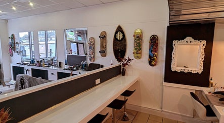 Trendy interior of Head Honcho's Barbershop/Salon in Newton Abbot, England featuring stylish decor.