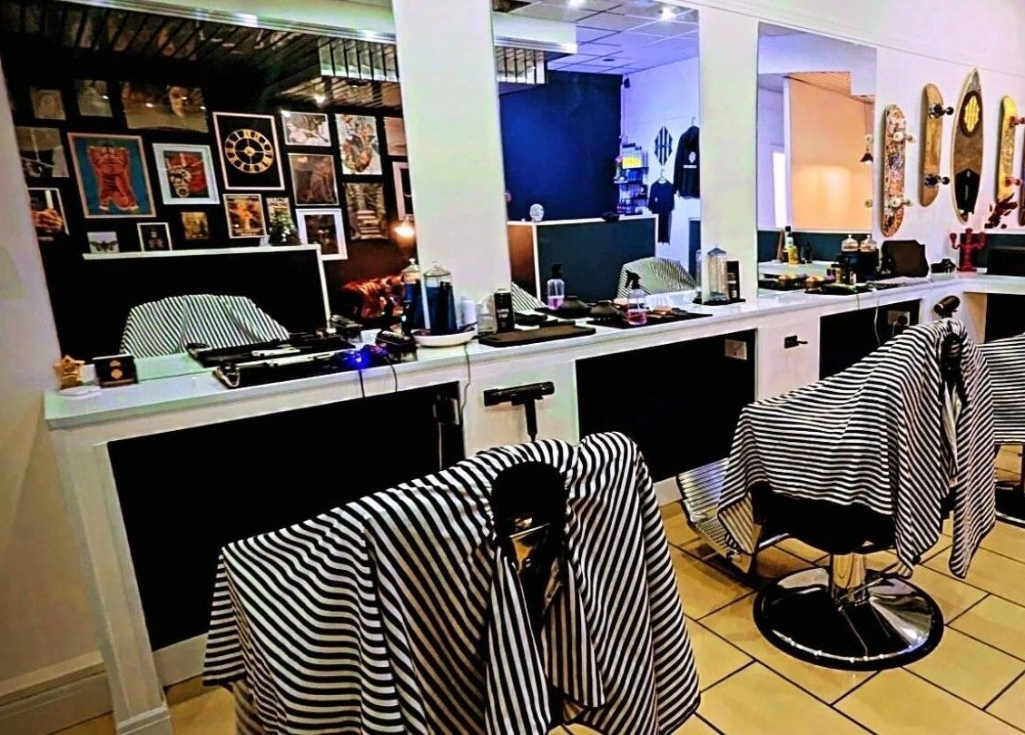 Chic interior of Head Honcho's Barbershop/Salon in Newton Abbot, England, GB showcasing sleek, modern design.