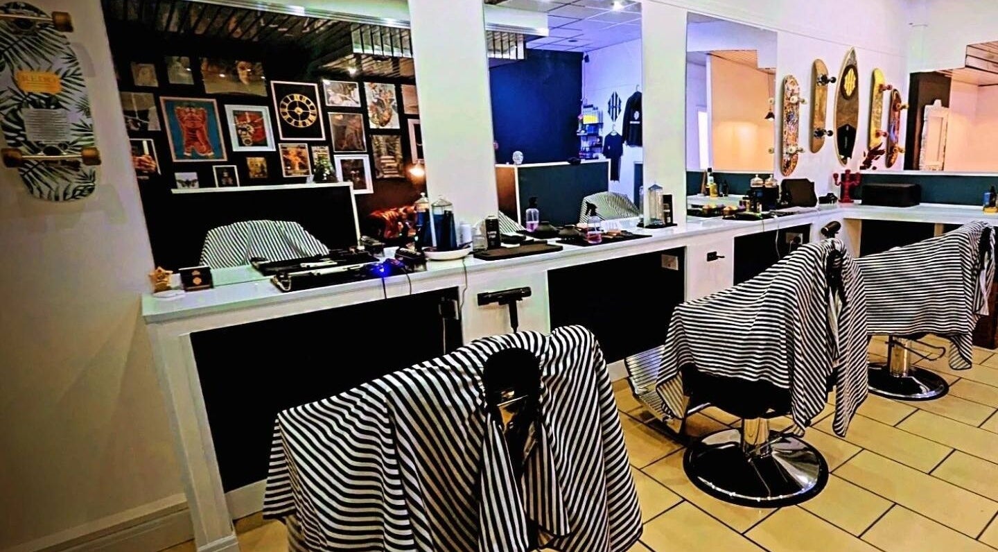 Chic interior of Head Honcho's Barbershop/Salon in Newton Abbot, England, GB showcasing sleek, modern design.