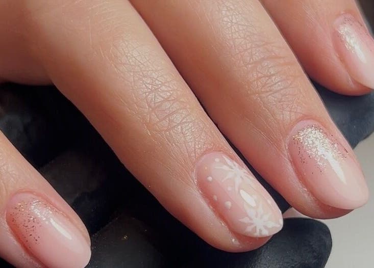 Delicate nail art with glitter at TW Beauty and Nails, Milford Haven, Wales, GB.