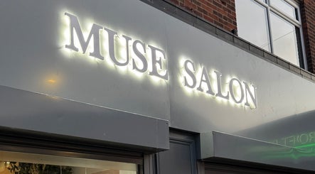 Brightly lit Muse Salon sign at By Kate Easton, Blyth, England, GB, showcasing elegance.