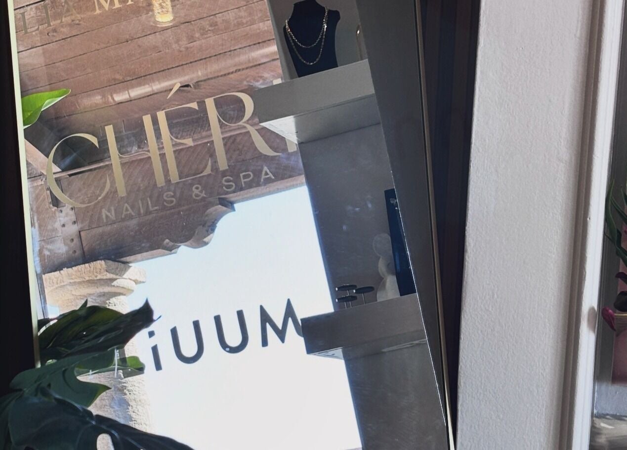 Elegant interior at Chéri Nails and Spa, El Paso, Texas, US, with decorative plants and accessories.