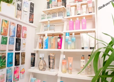 Assorted tanning products on a display rack at Golden Tanning Studio, Wadebridge, England, GB.