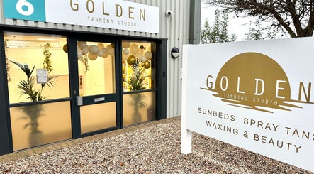 Front view of Golden Tanning Studio, Bude, inviting entrance in Bude, England, GB.