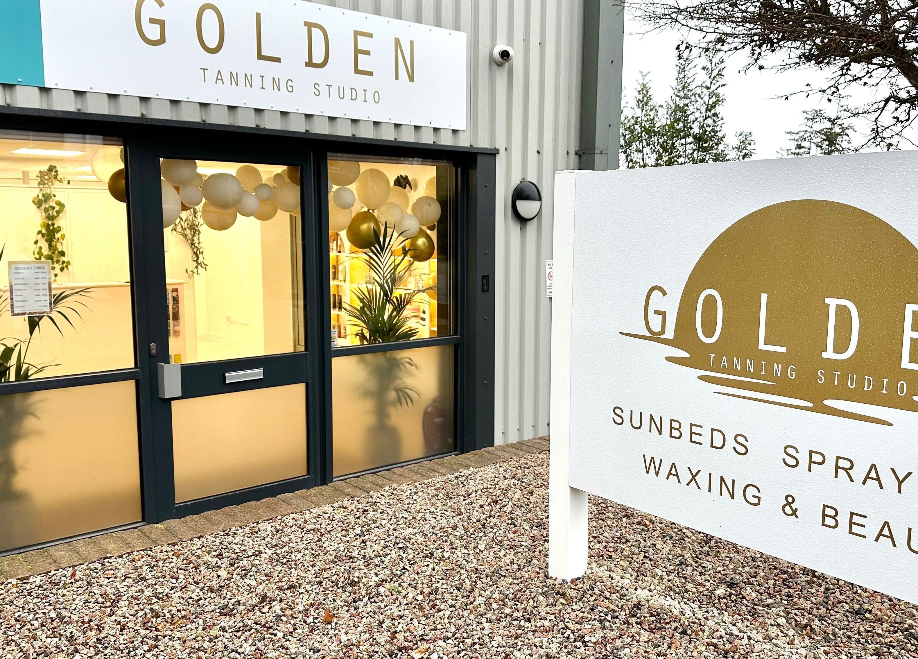 Front entrance of Golden Tanning Studio, Bude with a bright, inviting facade in Bude, England, GB.