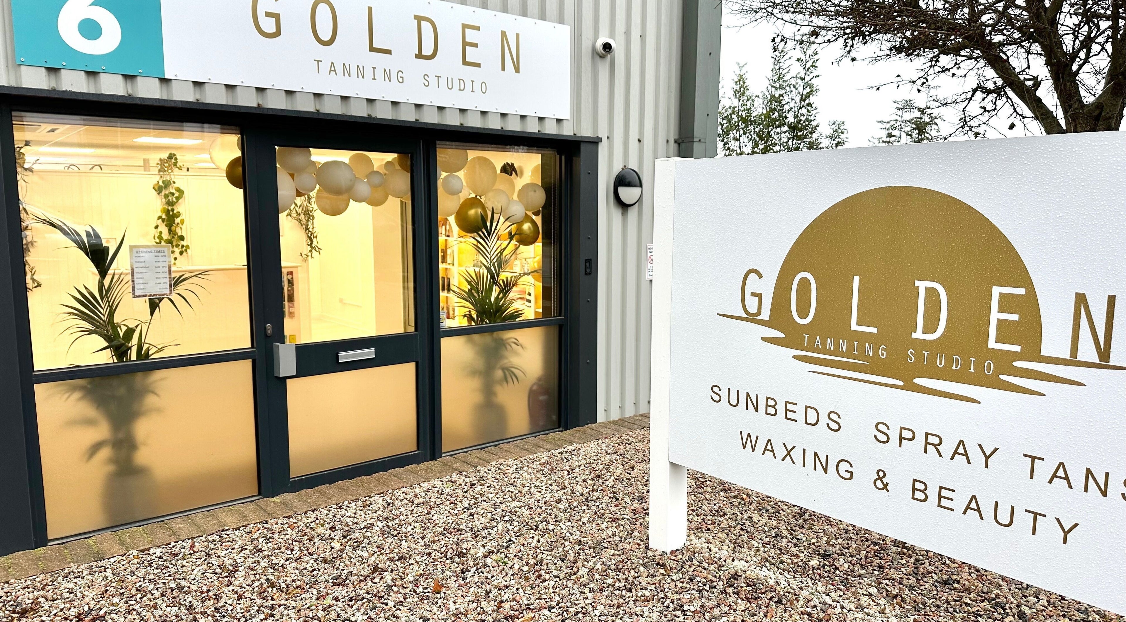 Front entrance of Golden Tanning Studio, Bude with a bright, inviting facade in Bude, England, GB.