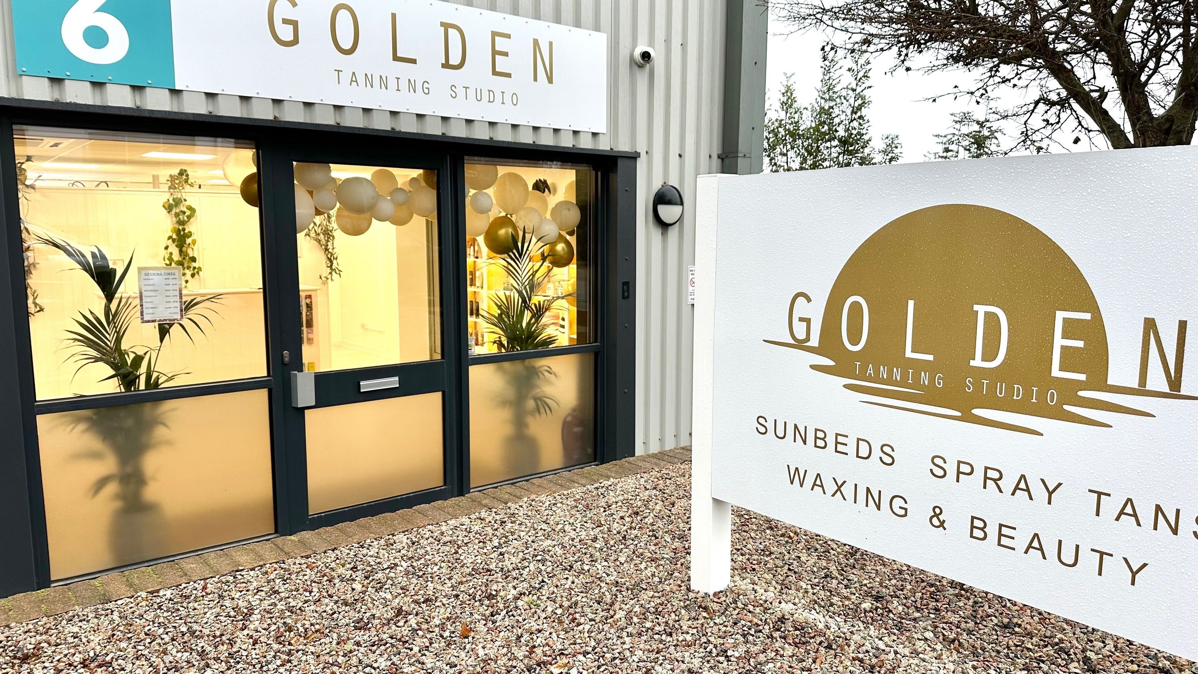 Front entrance of Golden Tanning Studio, Bude with a bright, inviting facade in Bude, England, GB.