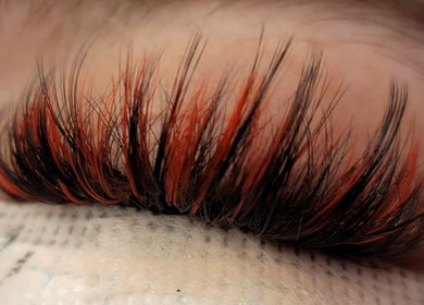 Dramatic eyelash extensions at LARENEGADE Lashes Aesthetics Wellness in Puslinch, Ontario, CA, featuring bold colors.