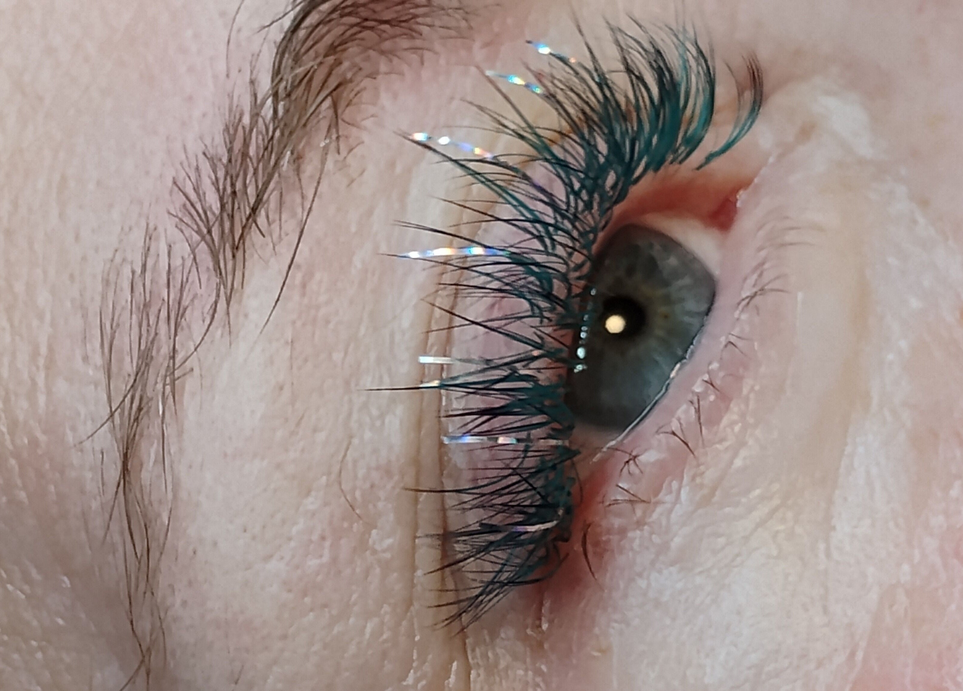 Close-up of glittery eyelash extensions by LARENEGADE Lashes Aesthetics Wellness Guelph/Puslinch, Guelph, Ontario, CA.